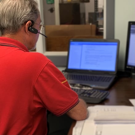 photo of engineer on the phone at CNC Engineering